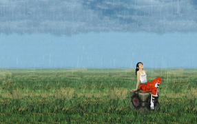 Девушка под дождем на поле