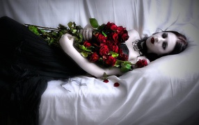 Vampire girl with a bouquet of roses