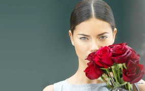 Adriana with a bouquet of roses