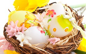 Flowers and eggs in basket for Easter