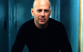 Famous movie actor Bruce Willis in blue room