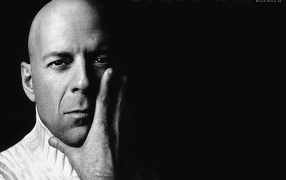 The famous actor Bruce Willis on a black background