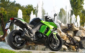 	  Motorcycle at a fountain