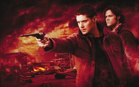 Dean aims a gun in the TV series Supernatural