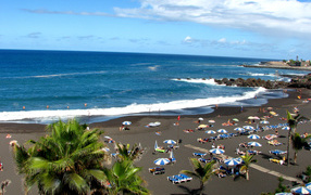 Tourism on the black beach in Tenerife
