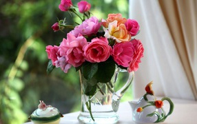 Bouquet of roses in a glass jug