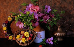 Flowers in a jug in the basket