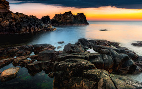 Beautiful rocky shore and sunset