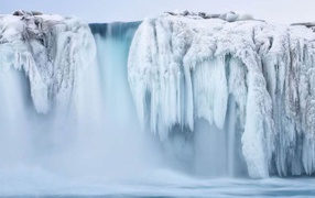 Frozen waterfall and mist
