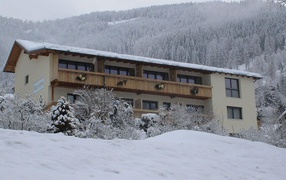 House on a background of mountains in the ski resort of Bad Kleinkirchheim, Austria