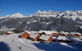 House on a background of mountains in the ski resort of Schladming, Austria