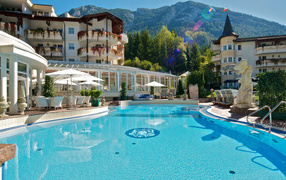 Swimming pool on a background of mountains in the resort of Bad Tattsmansdorf, Austria