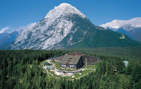 The hotel is on the background of mountains in the resort-Büchen Telfs, Austria