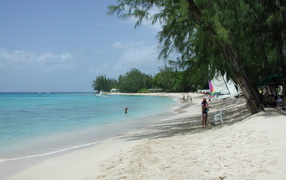 People resting on the beach in barbados