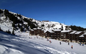 Skiers in the ski resort of Meribel, France