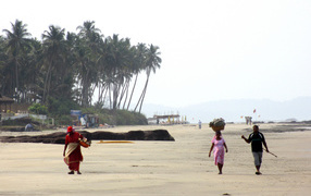 Residents of Ashwem on the beach