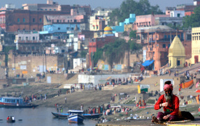 The man on the background of the city of Varanasi