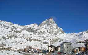 City on a background of mountains in the ski resort of Cervinia, Italy