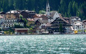 Houses on the lake at the resort Alleghe, Italy