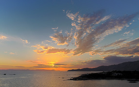 Sunset on the beach in the resort of Villasimius, Italy