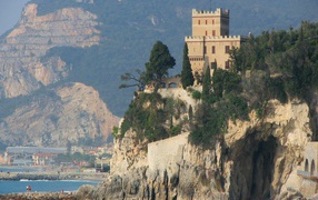 Tower on a rock at the resort Finale Ligure, Italy