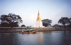 Boat on the background of the temple at the resort Lopburi, Thailand