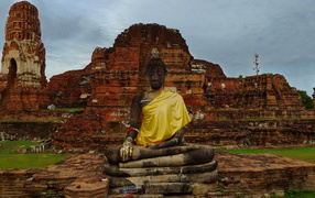 Buddha on a background of ruins of the temple at the resort Ayuthaya, Thailand