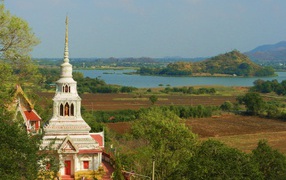 Temple on a background of lake at the resort Lopburi, Thailand