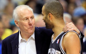Basketball player Tony Parker with coach Greg Popovich