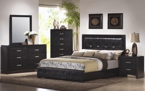 Bed of black leather in the bedroom