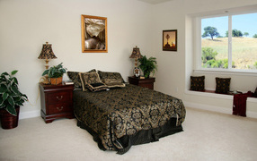 Black bedspread on the bed in the bedroom
