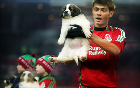 Footballer Diniyar Bilyaletdinov with a dog