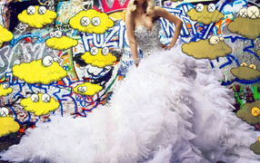 Girl in white dress on background of the graffiti