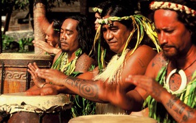 Polynesian tattoos on his arms