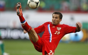 Russian midfielder Victor Fayzulin kicks the ball