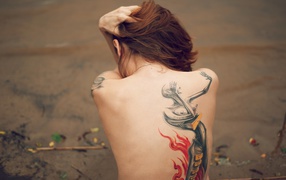 The female figure on the tattoo