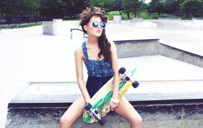 The girl has a skateboard
