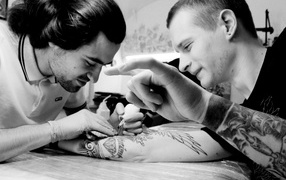 The guy doing the tattoo