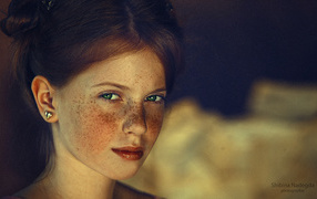 The red-haired girl with green eyes