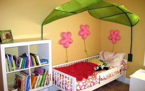 Umbrella over the bed in the nursery