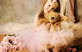 Young ballerina with bear