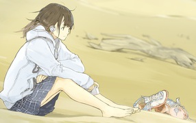 Anime girl with headphones sitting on the beach