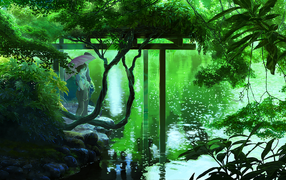 Пара под зонтом на берегу озера