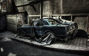 Abandoned car on a city street, photo HDR