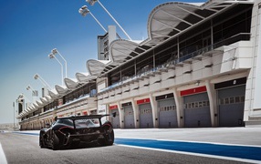 Black McLaren P1 in hangars