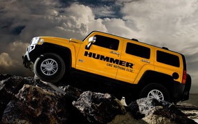 Yellow Hummer on the rocks