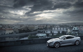Gray Aston Martin on the background of the city