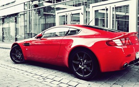Red Aston Martin Vanquish on the street