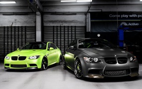 Green and black BMW M3 in the garage