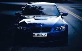 The dark blue car BMW 3 Series